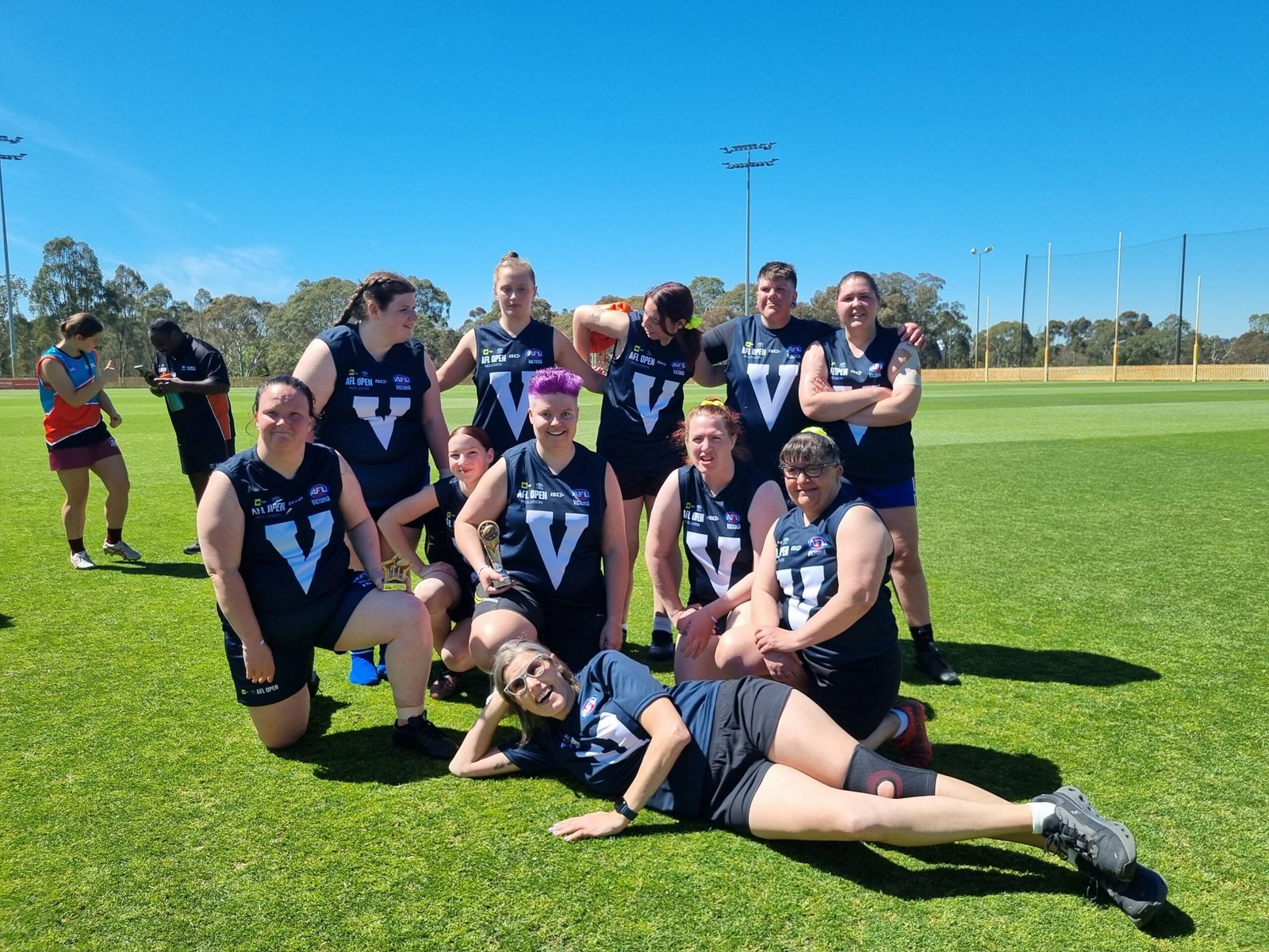 FIDA women's football players pose for a team photo on the field